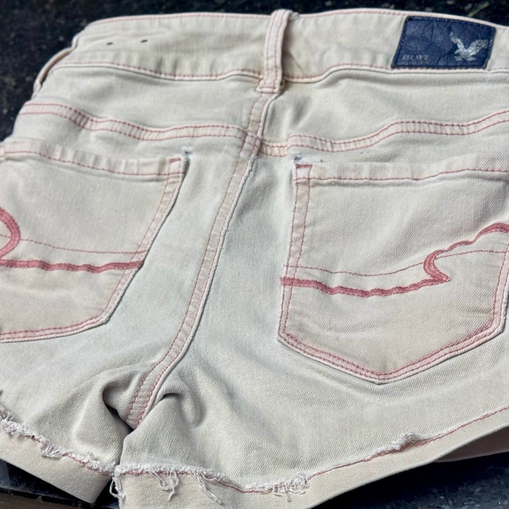 Cream Jean Shorts with Frayed Hem and Distressed Look